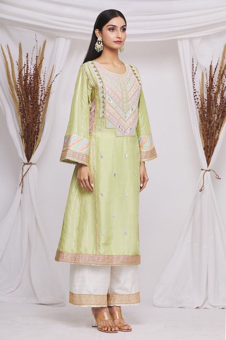 Olive green kurta with paisley and floral embroidered motifs. Paired with pant and dupatta.
Components:3
Pattern:Embroidered
Type of Work:Floral,paisley motifs
Neckline:Round
Sleeve Length:Long sleeves
Fabric:Silk,organza
Color:Green
Other Details:
Embroidered border
Cutwork border
Sheer dupatta
Tassel border
Occasion:Mehendi and Haldi - Aza Fashions Pista Green Chanderi Kurta With Resham Embroidery, Green Art Silk Unstitched Suit With Dabka, Pista Green Chanderi Kurta With Dabka Work, Green Jamawar Kurta With Dabka Work, Festive Designer Lawn Suit In Pista Green, Festive Designer Wear Pista Green Lawn Suit, Green Silk Sets With Dabka Detailing, Anarkali Sets In Pista Green For Spring, Festive Designer Pista Green Lawn Suit