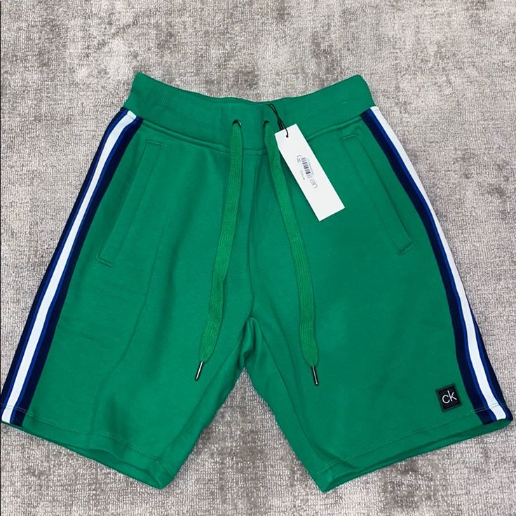 Green New With Tags Trendy Calvin Klein Summer Bottoms, Sporty Spring Weekend Bottoms, Sporty Spring Bottoms For Weekend Wear, Sporty Spring Weekend Wear Bottoms, Casual Blue Calvin Klein Bottoms, Calvin Klein Blue Cotton Bottoms, Calvin Klein Casual Blue Bottoms, Calvin Klein Spring Shorts, Sporty Calvin Klein Summer Shorts