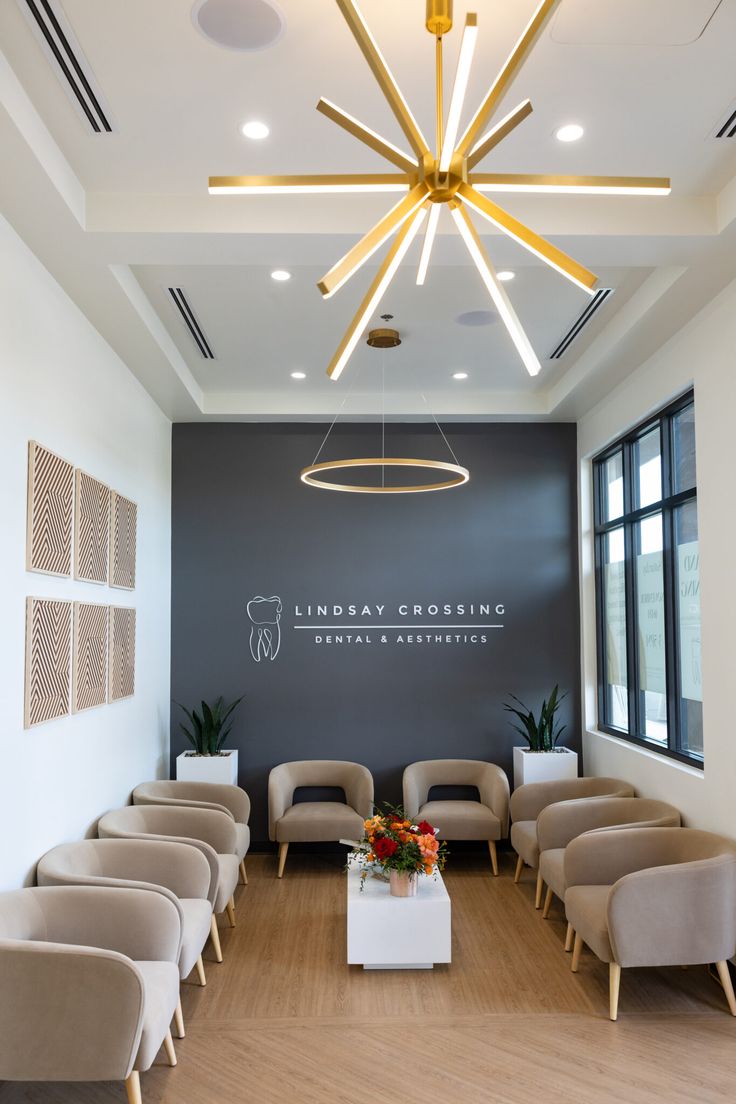 an empty waiting room with chairs and tables