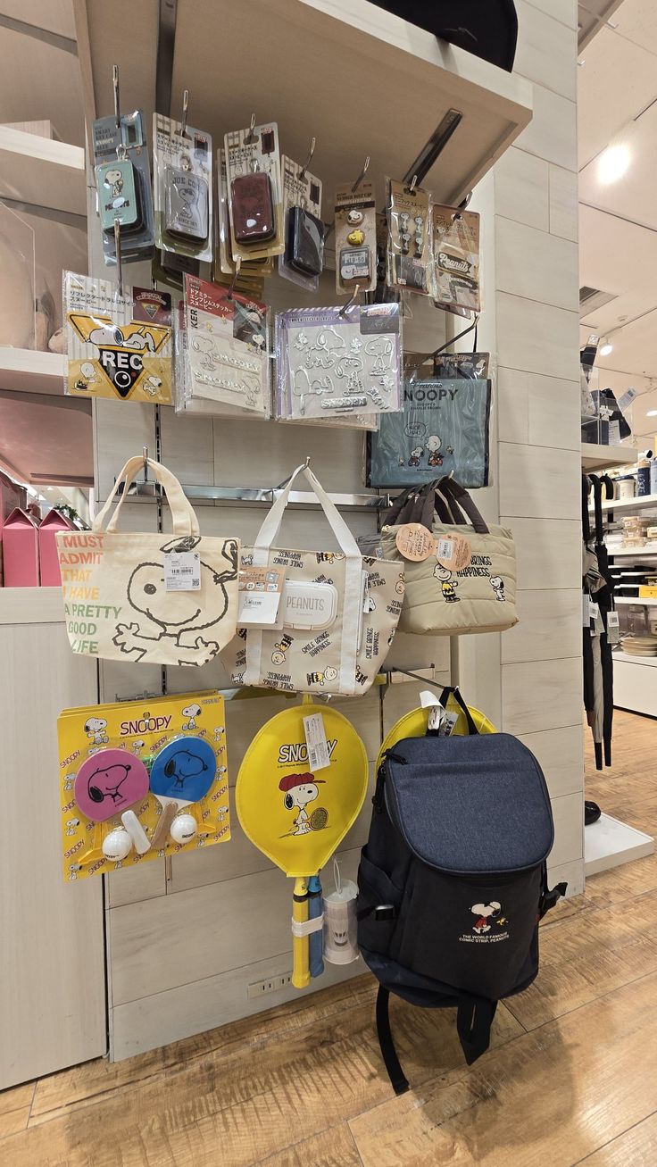 there are many items on the shelves in this store, including bags and purses