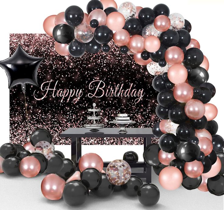 a black, pink and white birthday party with balloons