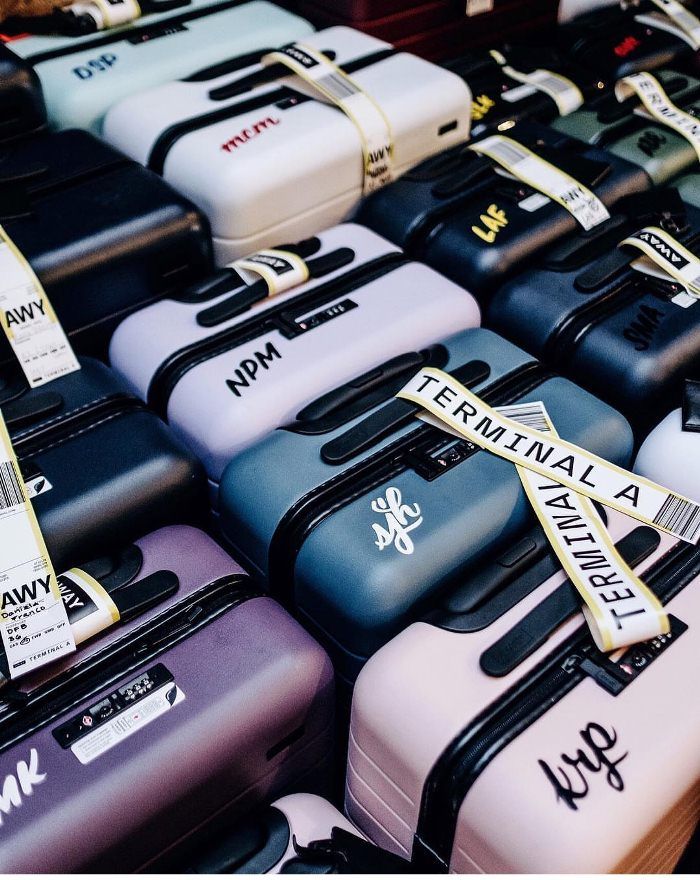 many different colored suitcases are on display