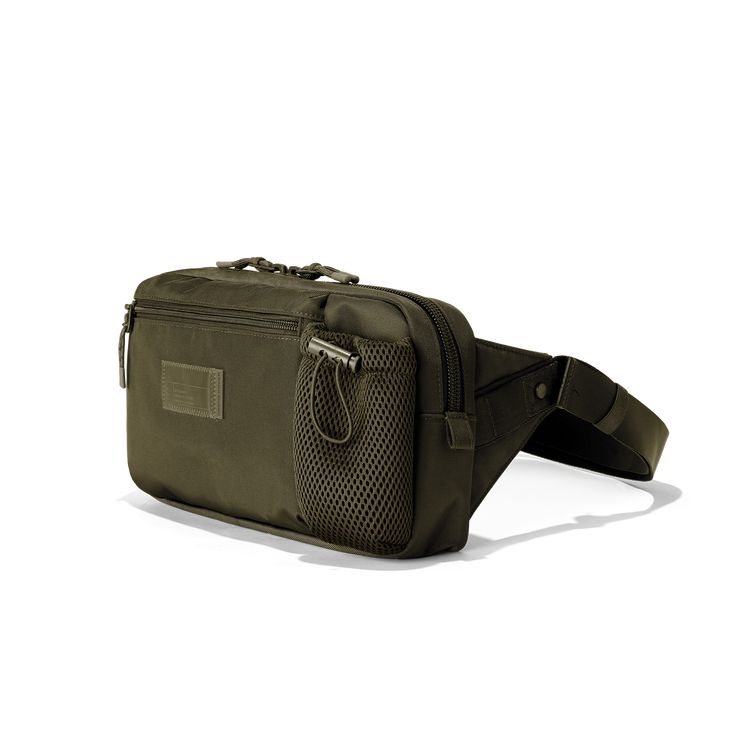 Not to start any rumors, but if Ace and Nova had a baby, it would be the Cairo Sling Bag. Just a touch bigger than our classic fanny, this smartly designed slim sling bag in dark green for travel lets you bring water, your passport, headphones, a book, and more along for the adventure. Equally perfect for exploring new cities and daily errands at home, this sustainable sling is mindfully made so it’s light on you and the planet, too. Functional Green Belt Bag For On-the-go, Green Crossbody Chest Bag For On-the-go, Green Functional Belt Bag With Adjustable Strap, Functional Green Belt Bag With Adjustable Strap, Functional Green Crossbody Belt Bag, Functional Green Travel Accessories For Everyday Use, Multifunctional Rectangular Chest Bag With Functional Pockets, Green Pouch Belt Bag For Travel, Functional Green Belt Bag With Removable Pouch