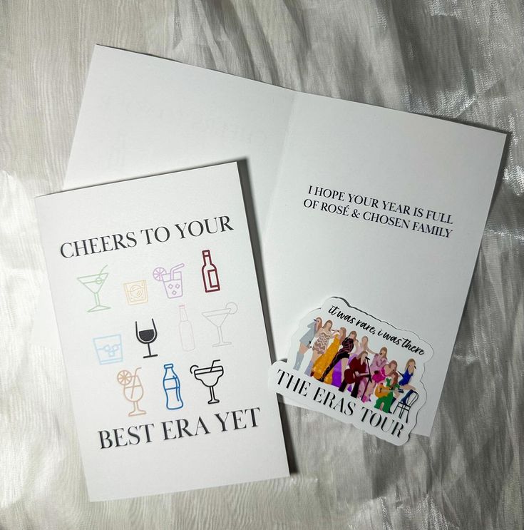 two greeting cards with the words cheers to your best - ever written on them and an envelope