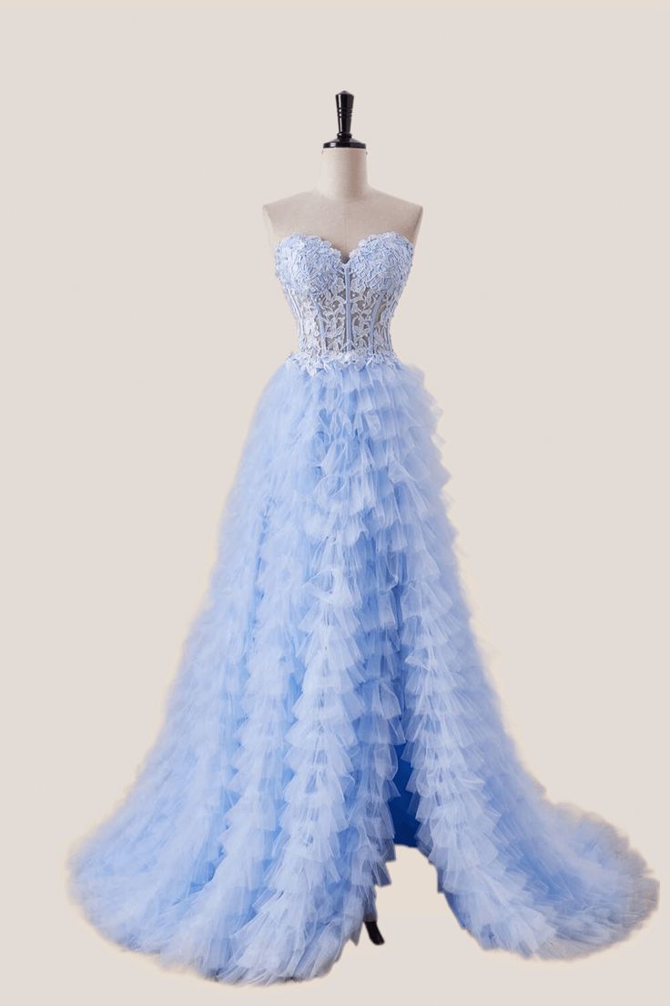 a light blue dress on a mannequinl stand with a bustier and ruffled skirt