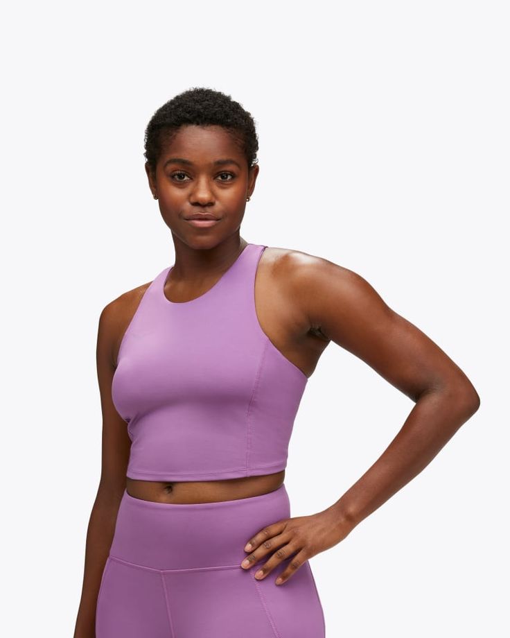 There are sports bras, and then there's this sports bra. Modernizing the classic workout staple with genius design updates, the Elaro Crop Bra delivers a figure flattering fit with higher neckline, curved rear hem, and razorback silhouette. Serving up organic lines that hug the body, we've finished this beauty with removable cups and an under-bust band for impact support. | Features. 75% recycled polyester/elastane/BioWick material. Shelf bra with encased elastic for low impact support. Removabl Purple Sleeveless Sports Bra For Yoga, Purple Activewear With Built-in Bra For Light Exercise, Purple Sportswear Sports Bra For Yoga, Purple Moisture-wicking Sleeveless Sports Bra, Purple Moisture-wicking Sports Bra, Athletic Fit Sports Bra For Pilates, Purple Medium Support Activewear For Training, Functional Purple Racerback Activewear, Purple Racerback Sports Bra For Workout