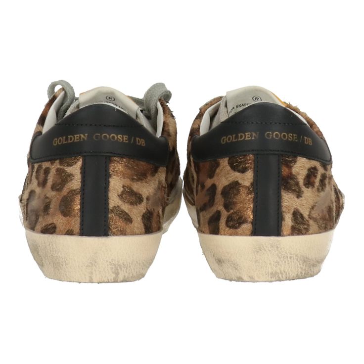 Unleash your wild side with the Golden Goose Women's Leopard Sneaker. This eye-catching footwear combines luxurious materials with a bold leopard print that adds a trendy twist to your sneaker collection. The distressed finish gives them an effortlessly chic look, while the cushioned insole provides comfort for all-day wear. Perfect for pairing with jeans or dresses, these sneakers elevate your casual outfits and make a stylish statement. Stand out in style with these fashion-forward sneakers th The Golden Goose, Visor Hairstyles, Leopard Sneakers, Knitted Swimsuit, Travel Capsule Wardrobe, Judy Blue Jeans, Boot Accessories, American Pride, Fine Jewelry Collection