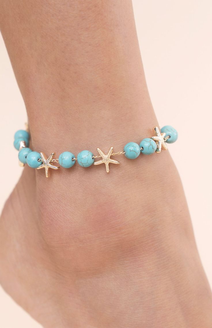 Online only! Enhance your beach style with Ettika's Starfish & Turquoise Beaded Anklet, adorned with turquoise beaded accents and playful starfish charms. This anklet adds a touch of coastal charm and bohemian elegance to your summer look.


	18k Gold Plated, Zinc, Reconstructed Turquoise
	8" with 1" extender
	Lobster Clasp Starfish-shaped Beaded Beach Jewelry, Summer Bracelets With Starfish Charm, Starfish Charm Bracelets For Beach Season, Turquoise Starfish Beaded Bracelets, Ocean-inspired, Summer Beach Anklets With Starfish Charm, Summer Strand Anklet With Starfish Charm, Starfish Anklets For Summer Vacation, Blue Beaded Starfish Anklet, Starfish Anklets For Beach Season