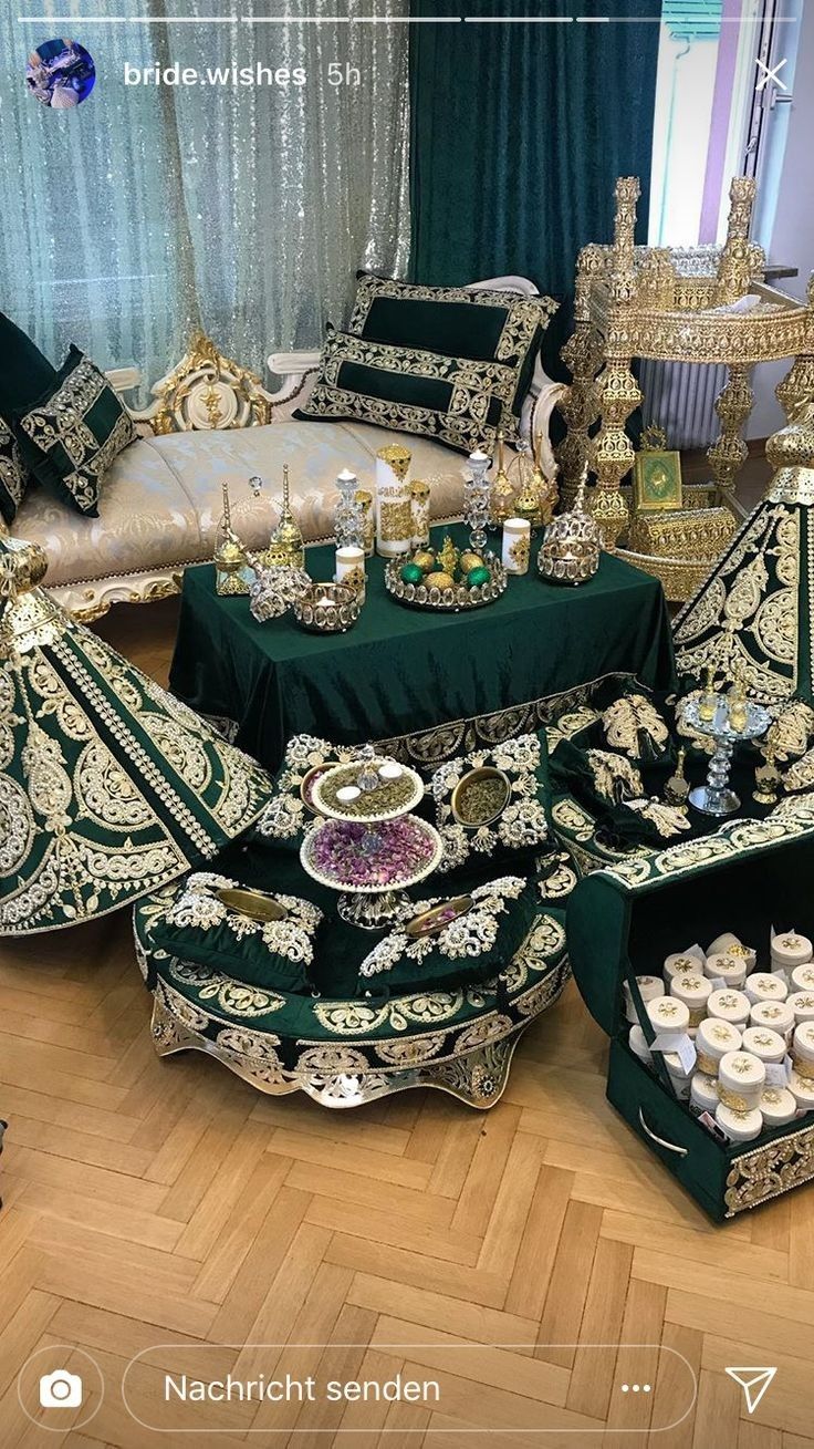 the table is covered with green and gold decorations