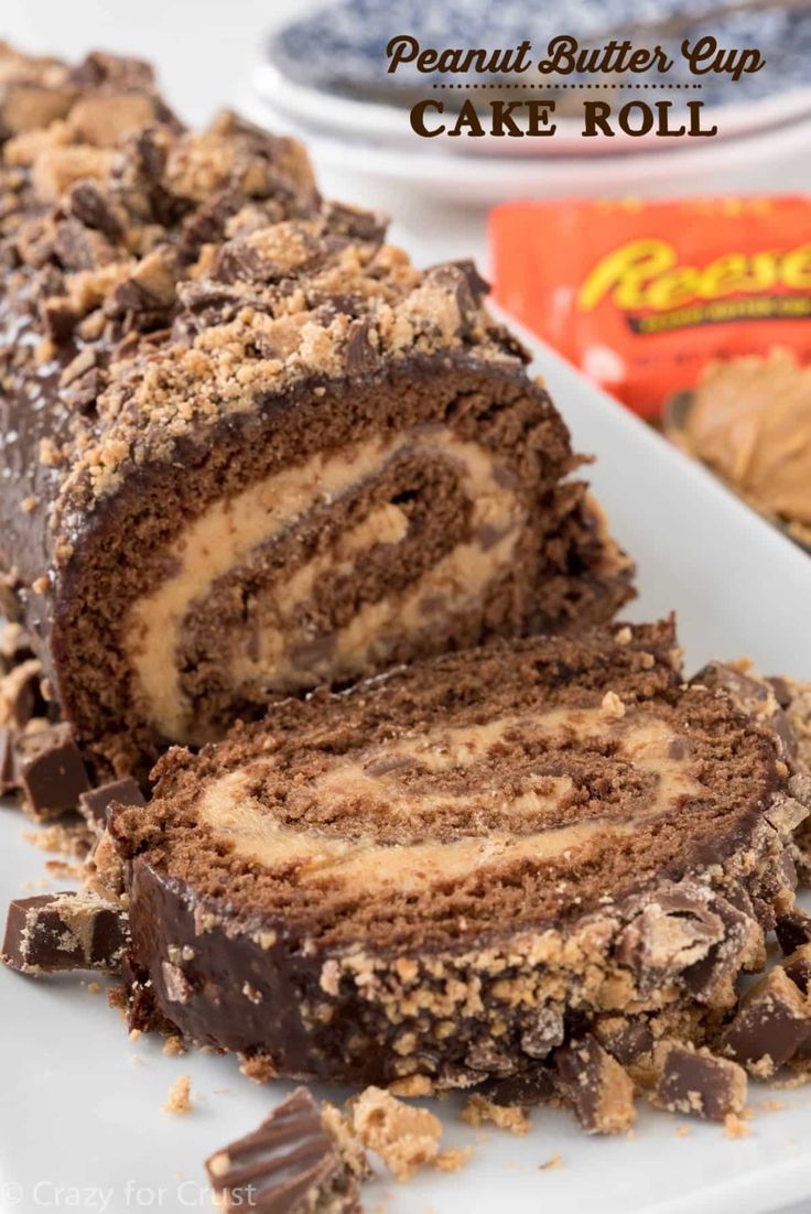 chocolate peanut butter swirl cake roll on a white plate