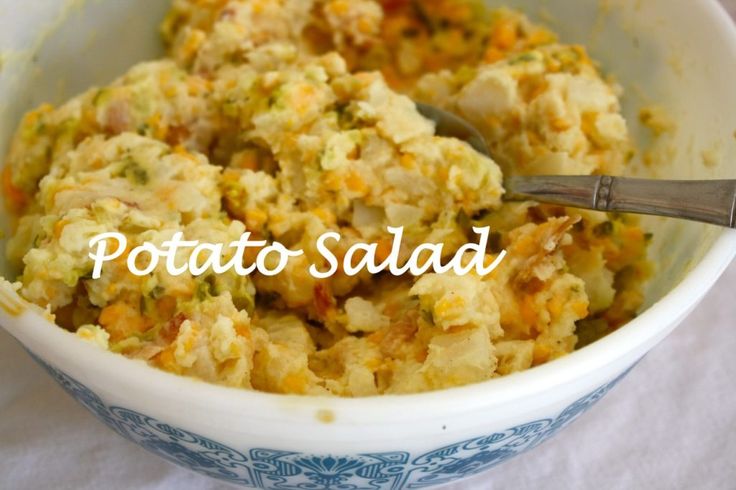 a bowl filled with potato salad on top of a table