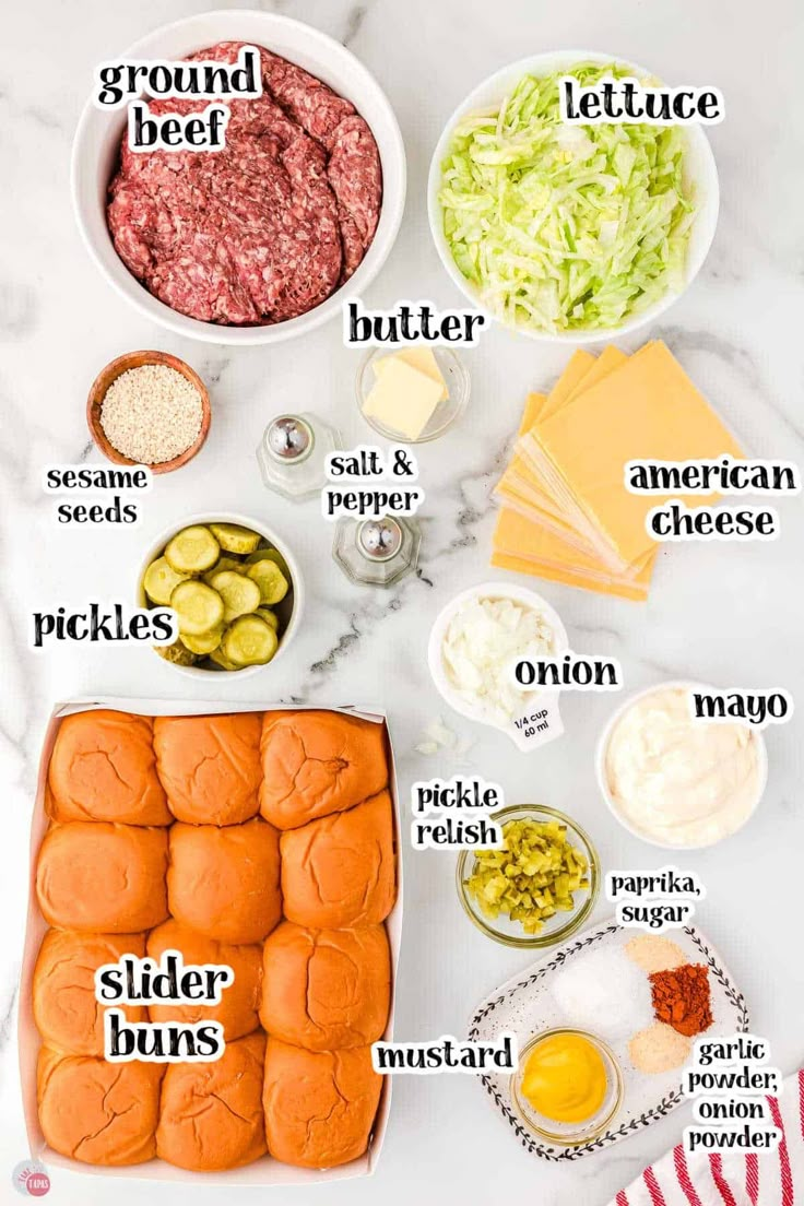 the ingredients to make an appetizer laid out on a white marble counter top