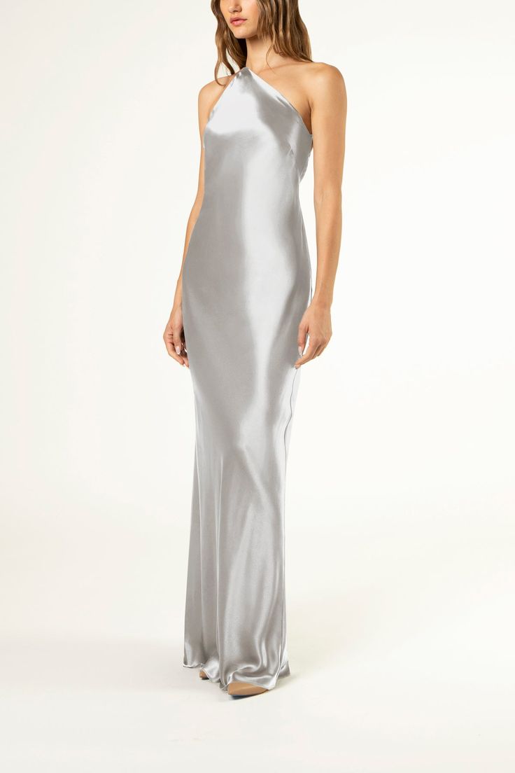 Pure silk charmeuse bias cut gown with double strap asymmetrical neckline. Features a dramatic open back with a draped cowl detail. Slips on and fully lined in silk. Made in USA. Composition: 100% silk Silver Grey Dress, Galvan London, Dresses Luxury, Bias Cut Dress, Designer Evening Dresses, Ladies Of London, Silk Charmeuse, Flare Skirt, Evening Wear