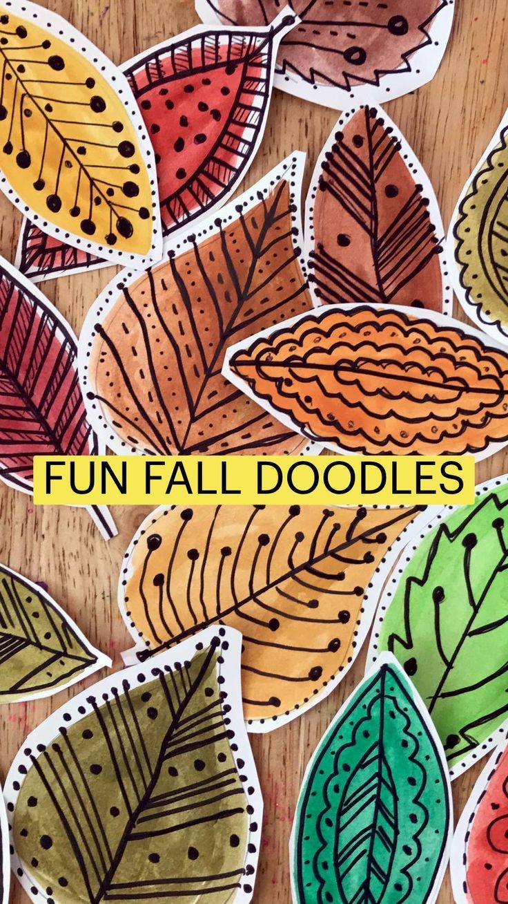 an image of fall doodles on a wooden table with the words fun fall doodles