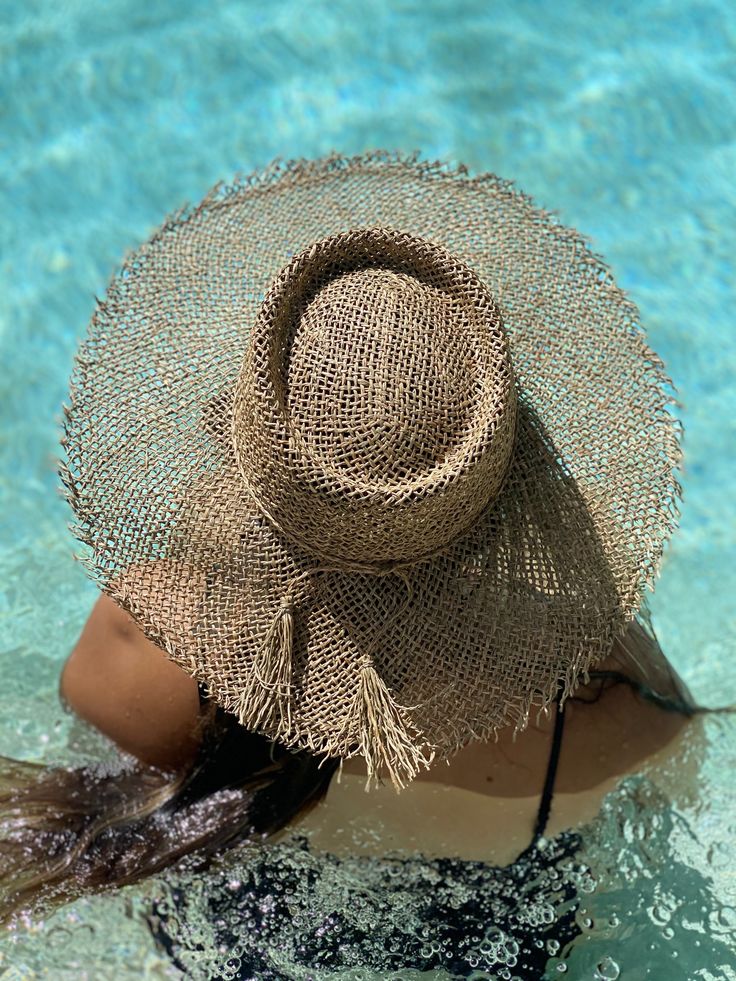 Raw edge tattered seagrass open weaved boater hat, adjustable inner drawstring for sizing Bohemian Short Brim Boater Hat, Bohemian Wide Brim Straw Hat With Open Weave, Bohemian Palm Leaf Boater Hat With Short Brim, Bohemian Open Weave Sun Hat For Vacation, Vacation Sun Hat With Wide Brim And Open Weave, Bohemian Straw Hat With Open Weave, Open Weave Wide Brim Straw Hat For Beach, Wide Brim Straw Hat With Open Weave For Vacation, Bohemian Jute Sun Hat For Vacation