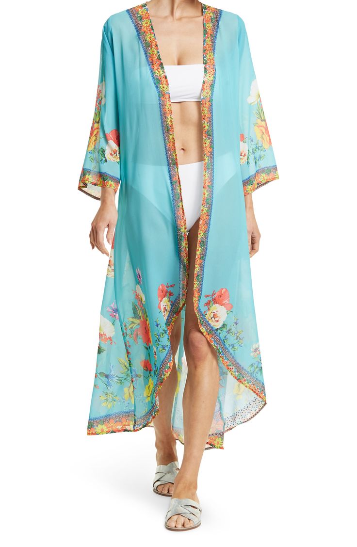 Unleash your free boho spirit in this longline duster styled with vivid allover blooms and airy flare sleeves. V-neck Flare sleeves Hi-low skirt All-over bloom print Solid Woven 100% polyester Hand wash cold, line dry Imported Model stats: 5'10", 32" bust, 25" waist, 36" hip. Model is wearing size S. Floral Print Flowy Maxi Cover-up, Bohemian V-neck Cover-up With Floral Print, Bohemian V-neck Floral Print Cover-up, V-neck Floral Print Festival Cover-up, Flowy V-neck Cover-up For Spring, Spring Flowy Maxi Cover-up, Spring Daywear Maxi-length Cover-up, Spring Daywear Maxi Length Cover-up, Blue Floral Print Cover-up For Spring