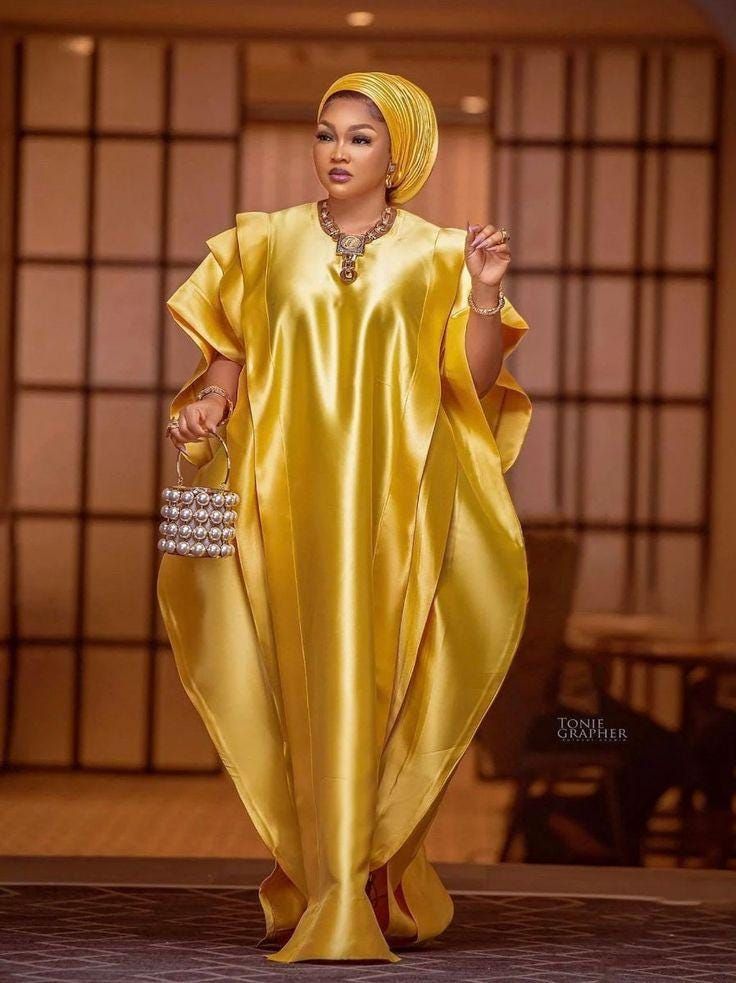 Introducing our elegant and timeless kafan dress, crafted from the finest Mikado silk. It includes a head wrap (note: "auto gele" is not included). Ideal for any occasion, including evening events, African celebrations, photo shoots, birthdays, weddings, and parties. This style can be customized to your preferences, with options to add or remove elements and choose from various colors. Washing instructions: Use mild soap and avoid bleach. Thank you for visiting our store. Please reach out for an Ankara Kaftan, African Kaftan Dress, African Gowns, African Kaftan, Nigerian Outfits, Ladies Caftan, Dress African, Caftan Dress, African Dresses