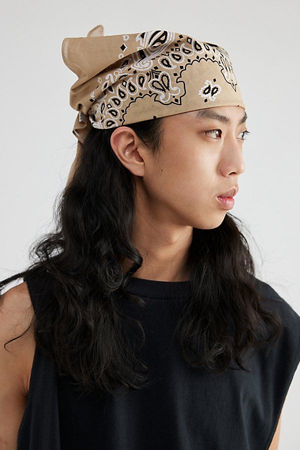 Essential Rothco bandana in a paisley print. Cotton bandana to tie at your neck & more. Features Rothco paisley pattern cotton bandana Versatile square bandana Lightweight cotton Content + Care 100% Cotton Hand wash Imported Size Dimensions: 22" x 22" | Rothco Paisley Pattern Cotton Bandana in Khaki, Men's at Urban Outfitters Bandana Hairstyles Men, Nostalgic 2000s, Neck Bandana, 1980s Fashion Trends, Hair Bandana, Shaggy Hair, Cotton Bandanas, Face Reference, Bandana Hairstyles