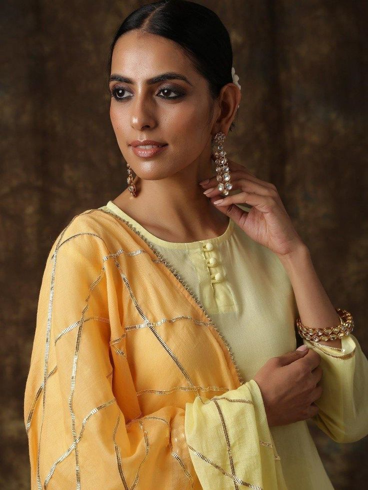 Ambika- Amaltas yellow-light orange sharara set - Trendroots Orange Chanderi Sharara With Mirror Work, Yellow Chinon Dupatta With Dabka Details, Yellow Saree Set With Mirror Work, Gold Sharara With Dabka Detailing And Straight Kurta, Yellow Palazzo Set With Mirror Work And Traditional Drape, Festive Orange Sharara With Dabka Detailing, Gold Sharara With Dabka Detailing, Yellow Chinon Sharara For Eid, Yellow Traditional Drape Palazzo Set With Mirror Work