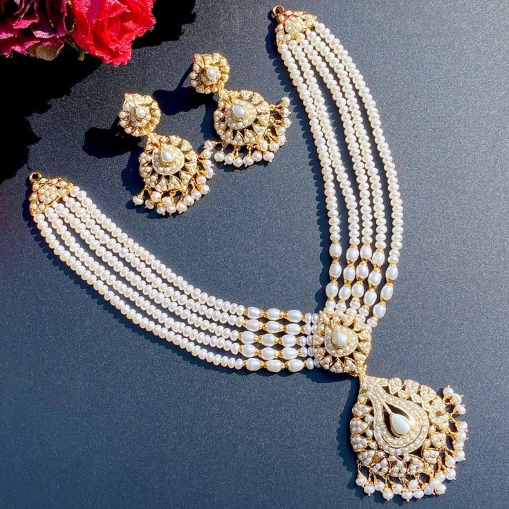 Featuring an all freshwater pearl string necklace with matching earrings in gold plated silver. A timeless and stylish look perfect for special occasions, with an understated elegance that will always be in fashion. Elegant Hand-set Pearl Necklaces, Elegant Gold Plated Pearl Necklace For Celebration, Elegant Gold Kundan Necklace, Gold Plated Pearl Necklace For Celebrations, White Pearl Drop Jewelry Sets, Elegant Long Pearl Drop Necklace, Elegant Pearl Drop Necklace For Celebration, Elegant White Pearl Drop Jewelry Sets, Classic Long Pearl Drop Necklace