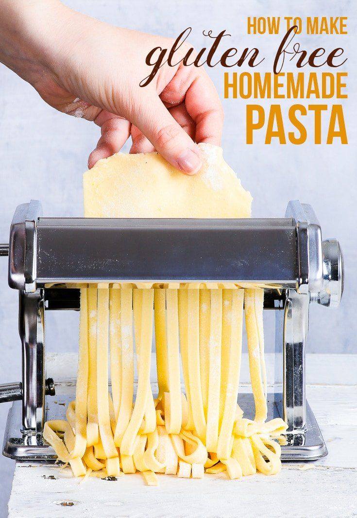 someone is making homemade pasta with the help of a manual grated cheese slicer