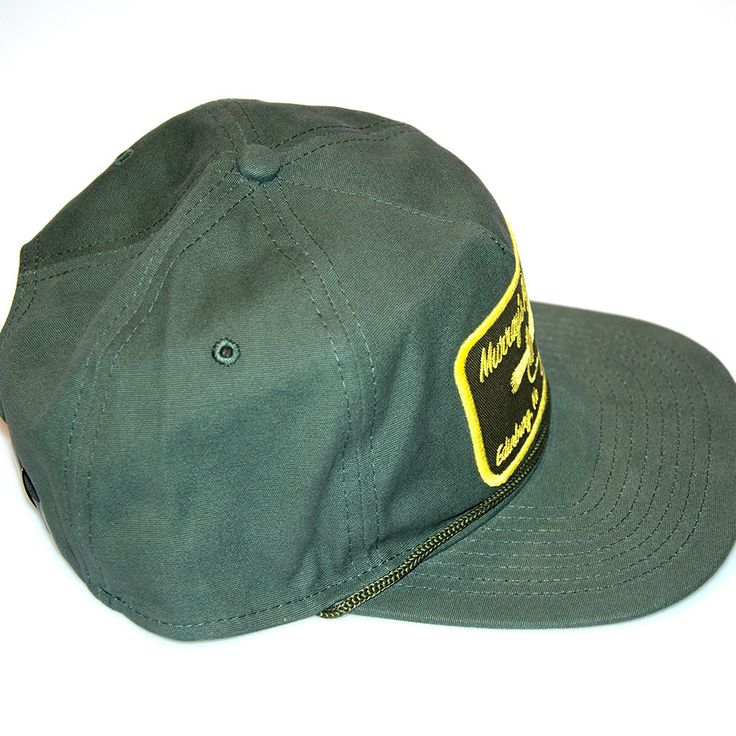 The ranger style hat features a trendy flat bring style with tonal cord detail for a modern touch. Features the Murray's Fly Shop name with a popper embroidered on the front. One size fits most with the leather adjustable metal clasp on the back. FEATURES FABRIC : 100% BRUSHED COTTON TWILL SHAPE : STRUCTURED MEDIUM PROFILE CLOSURE : LEATHER METAL CLASP SIZE : OSFM VISOR : FLAT DETAILS : SEAMLESS FRONT PANEL, INTERNAL MESH STAY, BRAIDED CORD AT VISOR