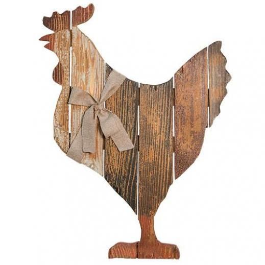 a wooden rooster with a bow on it's head is standing in front of a white background