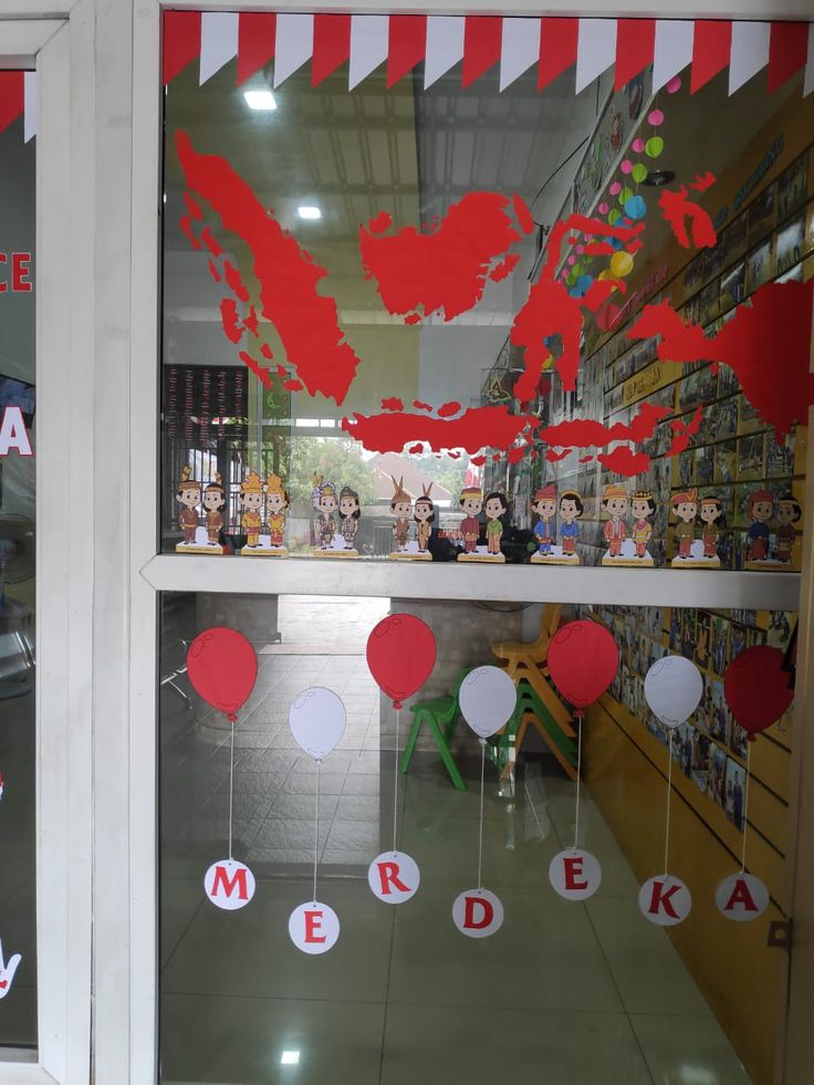 a store window decorated with red and white balloons