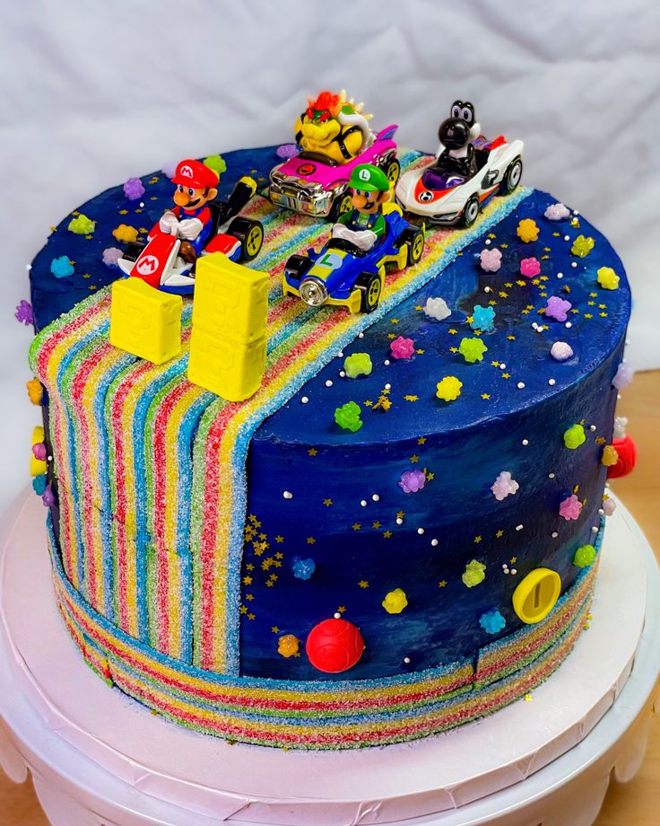 a birthday cake with cars and stars on it