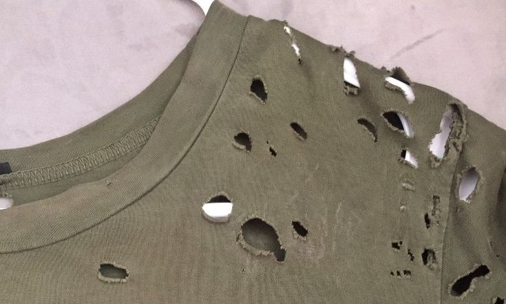 a shirt with holes in the middle of it