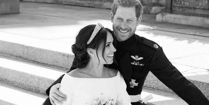 a man in uniform is hugging a woman on the steps