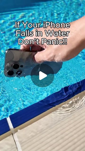 someone is holding their cell phone in the water and it says, if your iphone falls in water don't panic