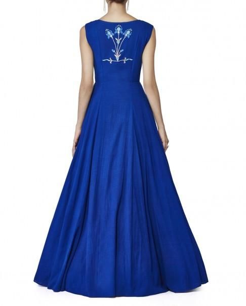 This royal blue gown is in cotton gorgette fabric with cancan underneath it. The embroidery of this royal blue gown is in thread hand embroidery in the centre of the gown as a panel. Can be customised in any colour. Note: Delivery within 4-6 weeks once the measurements are received/ You will get the measurement form within 24 hours of order placement. We always put orders on hold for 24 hours due to our Cancellation Policy so that if you want to cancel the order you can cancel it without hassles Anarkali Floor-length Dress With Embroidered Neckline, Fitted Dress With Embroidered Neckline For Reception, Anarkali Dress With Embroidered Neckline For Reception, Designer Maxi Dress With Embroidered Neckline, Embroidered Neckline Maxi Dress, Blue Floral Embroidered Dress With Fitted Bodice, Maxi Dress With Embroidered Neckline, Anarkali Cotton Dress With Embroidered Neckline, Designer Embroidered Maxi Length Dress