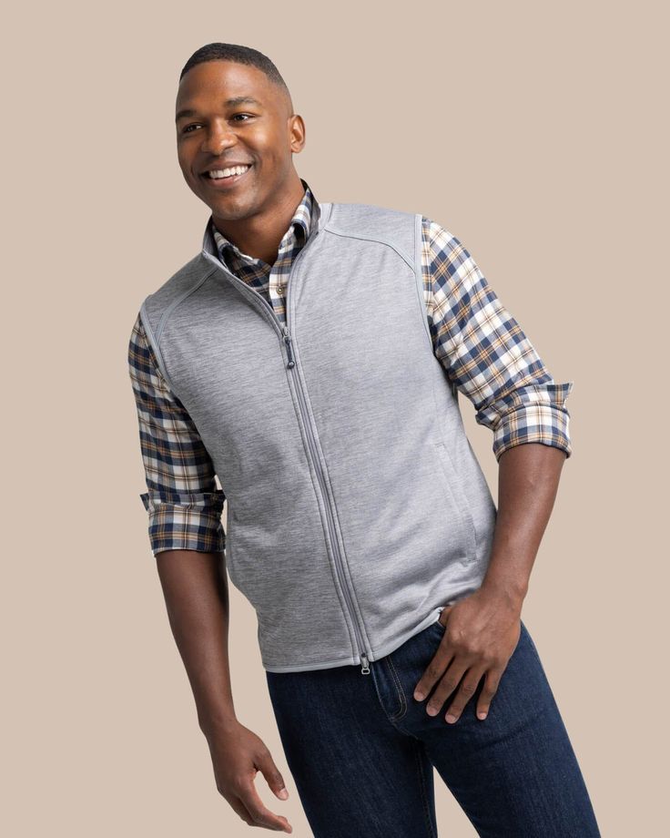 This Baybrook Heather Vest is the timeless vest you'll reach for as the temps drop. This classic silhouette is crafted with a lightweight heathered material that is the perfect pair for holiday sport shirts. This men's vest is great for every occasion from crisp weekday evenings to festive holiday gatherings. Style: 10058 Classic Outdoor Vest, Classic Sleeveless Vest For Outdoor, Gameday Fashion, Lightweight Vest, Sport Shirts, Sophisticated Dress, Cute Swimsuits, Men's Vest, Comfy Sweaters