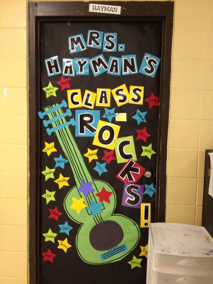 a classroom door decorated with the words mrs hyffinn's class rocks