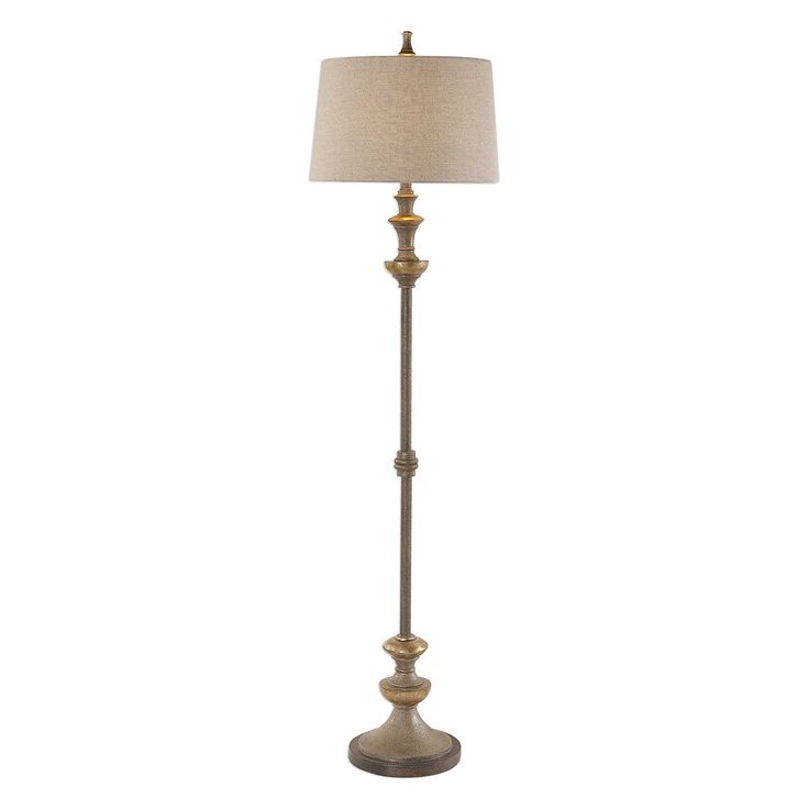 a floor lamp with a beige shade on it's base and a white linen shade