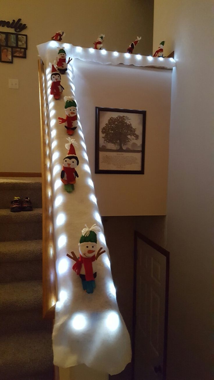 christmas decorations are lined up on the stairs