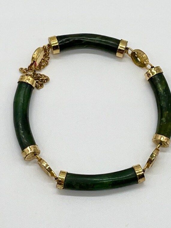 Antique Bracelet Chinese ORIENTAL Symbols Nephrite Antique Jade Vintage Bracelet Nephrite Gold 14k Yellow Gold Green Jade Luck Bracelet Gorgeous vintage jade bracelet with symbols bringing good luck and health. Vintage green Nephrite Jade vintage bracelet with chain clasp and gold-plated baseles, untreated natural Jade. Since ancient times, jade has been considered a stone that cures many diseases, especially kidney diseases. Material: Natural Nephrite Jade, metal (probably 14k gold plated silve Ancient Bracelet, Antique Jade, Elephant Jewelry, Antique Bracelets, How To Clean Metal, Jade Bangle, Nephrite Jade, Vintage Bracelet, Jade Bracelet