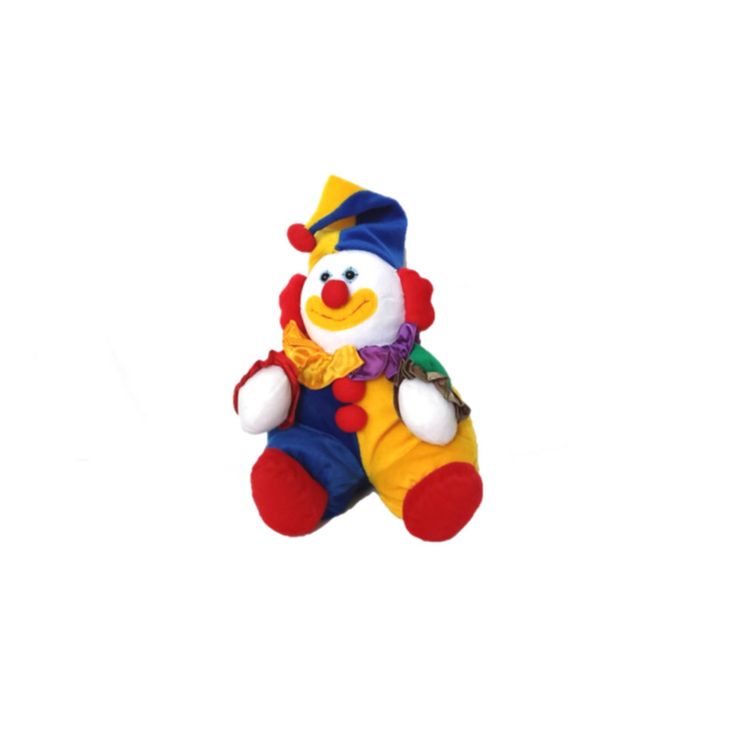 a stuffed toy clown sitting on top of a white surface