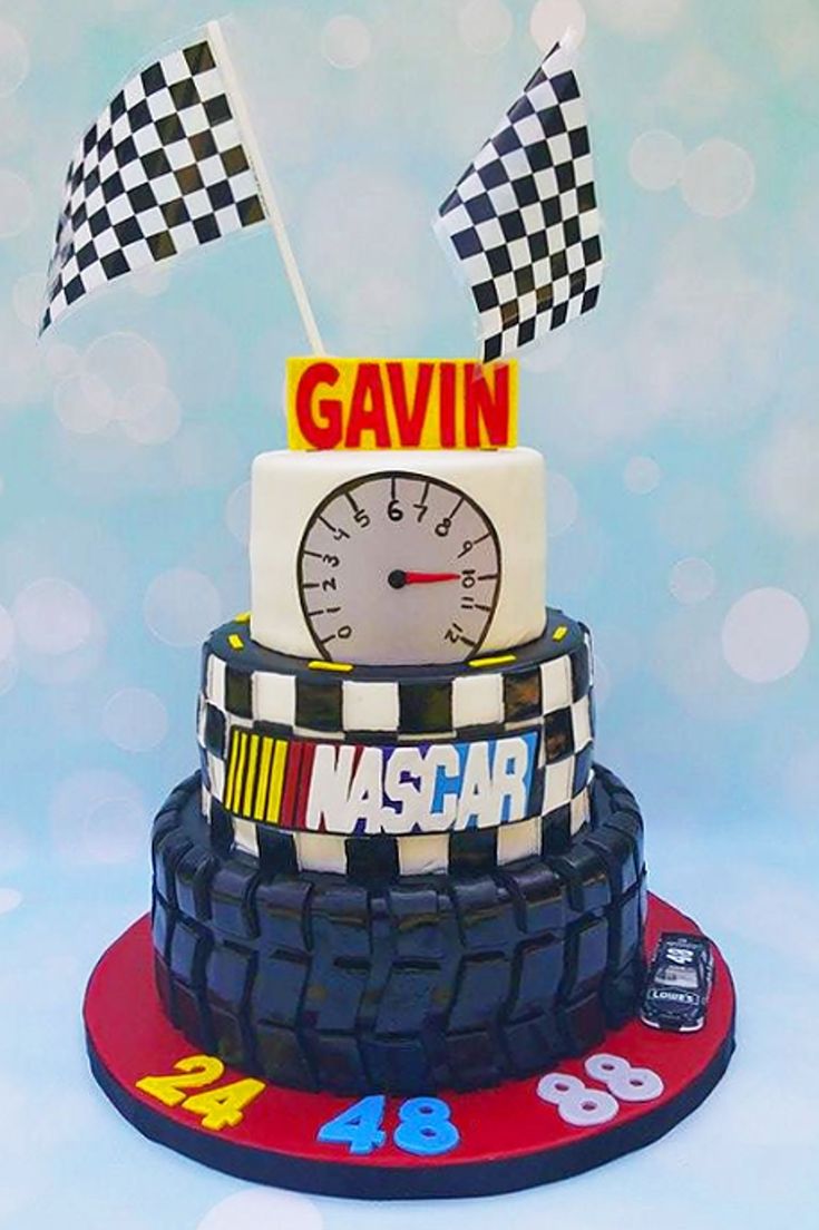 a cake made to look like a race car with flags on top and the number 46