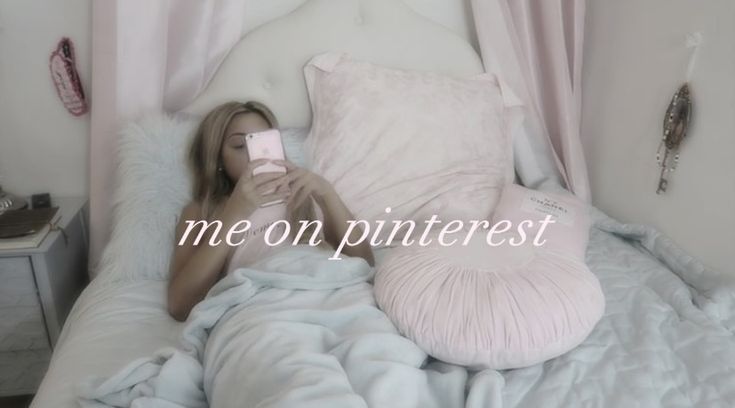 a woman laying in bed holding a cell phone and taking a selfie with the caption me on pinterest