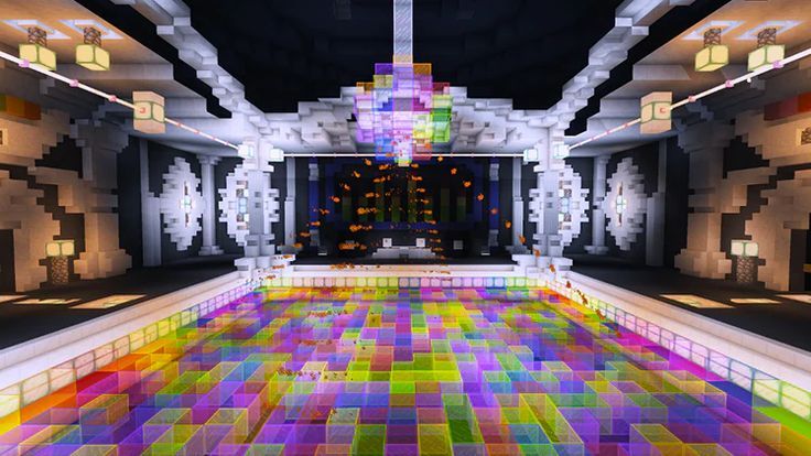 a room filled with lots of different colored tiles and lights on the ceiling next to a tiled floor