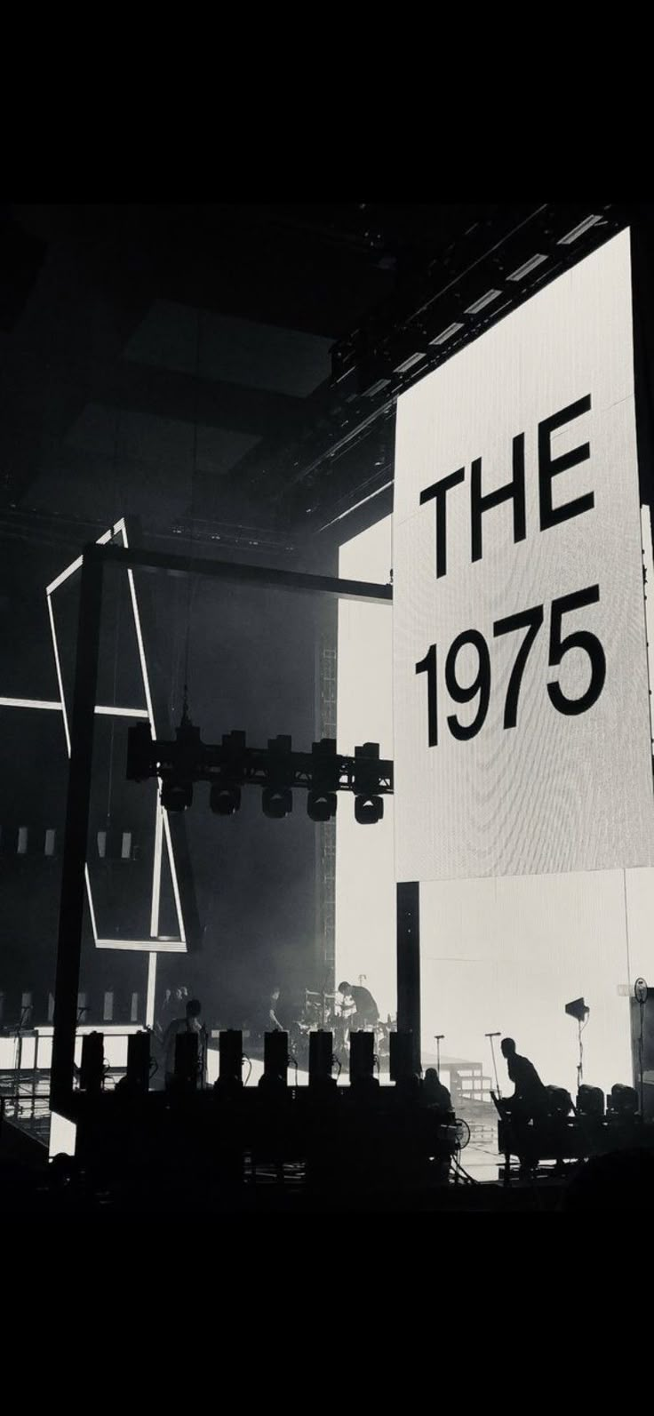 a large sign that reads the 1970 on it in front of an audience at a concert