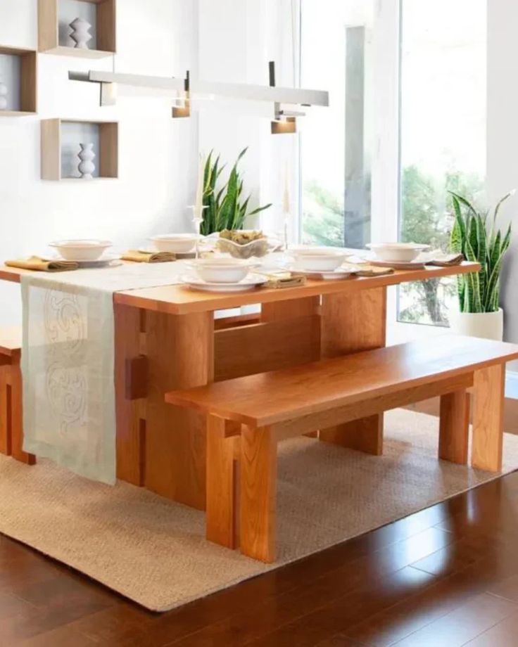 a wooden table and bench in a room