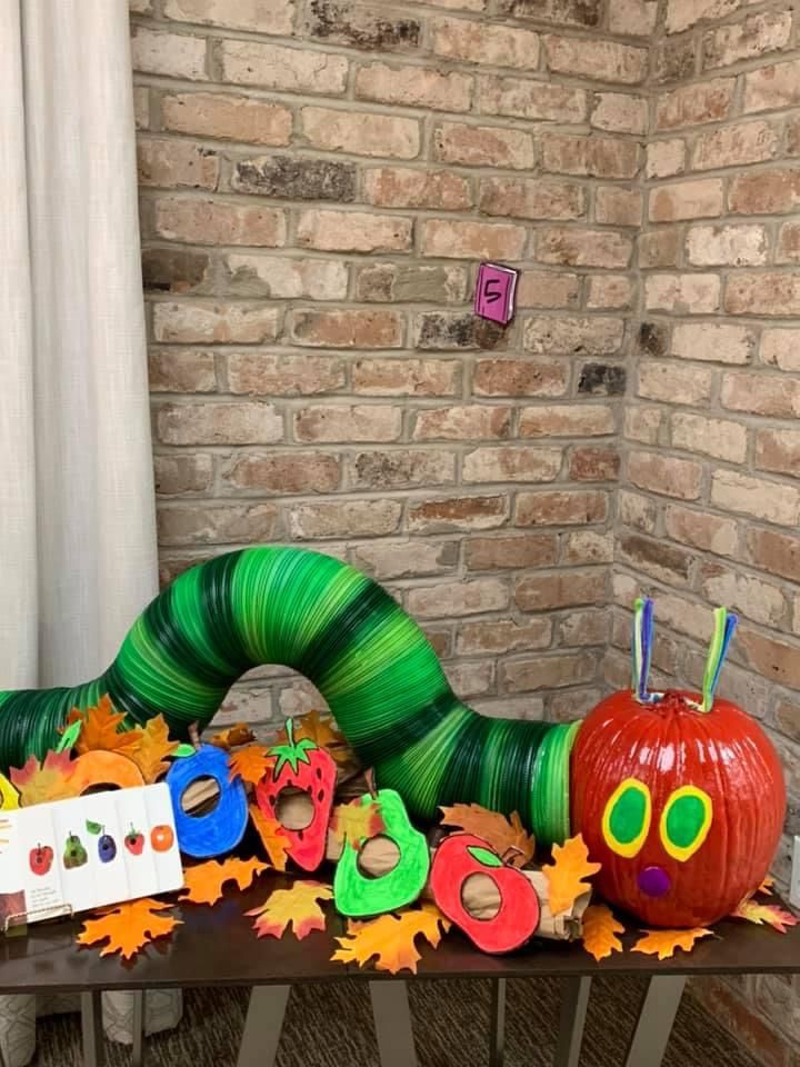 the very hungry caterpillar has been decorated with leaves and pumpkins for halloween