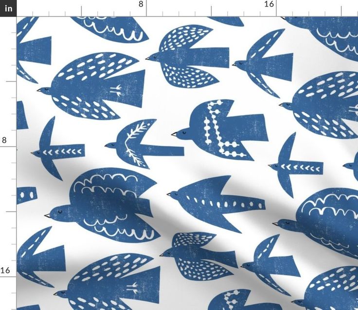 a blue and white fish pattern on a white background, with an area for the ruler to scale