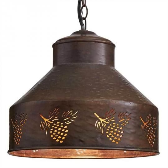 a light hanging from a ceiling fixture with pineapples on the top and bottom