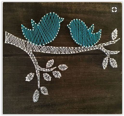 two blue birds sitting on top of a tree branch with leaves painted on the branches