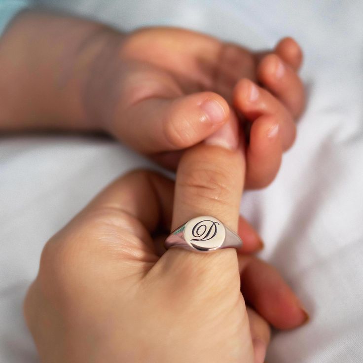 Make a statement with this unique Initial Signet Ring! This sleek and stylish ring is crafted from sterling silver and features your choice of an engraved initial. Let your signature be seen in a bold, beautiful way—add this timeless piece to your jewelry collection today! Sterling Silver Hypoallergenic, lead and nickel free Diameter 10mm Band Thickness 2mm #R010 Timeless Silver Initial Ring For Promise, Everyday Engraved White Gold Ring With Polished Finish, Everyday Engraved Initials Open Ring, Everyday White Gold Rings With Engraving Option, Everyday White Gold Engraved Ring With Polished Finish, Everyday Timeless Sterling Silver Engraved Ring, Sterling Silver Initial Ring For Everyday, Everyday Silver Signet Ring With Engraving Option, Classic Engraved Ring Stamped 925 For Everyday