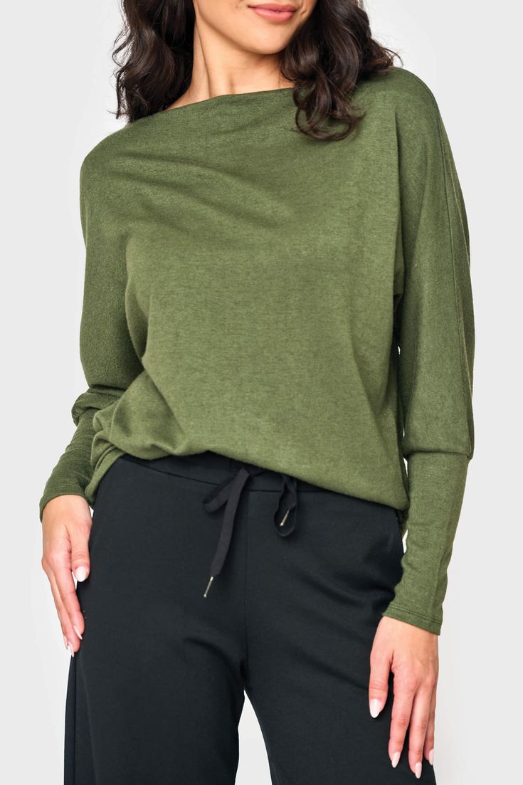 This sweater knit top is the epitome of relaxed style. With its eased fit and slouchy/off-shoulder design, it exudes effortless charm. The long sleeves feature high cuffs, adding a touch of sophistication. Made from super soft fabric, it offers both comfort and a luxurious feel. 50% Rayon | 28% Polyester | 22% Nylon Hand Wash Cold, Dry Flat Length 25 1/2" (size small) Drape Wide Neck Long Dolman Sleeve Eased Fit Easy 30-Day Returns & Exchanges Sabrina is 5'7 and wearing XS in Martini Olive Fine Knit Long Sleeve Casual Top, Casual Long Sleeve Fine Knit Top, Fine Knit Top For Fall Loungewear, Oversized Fine Knit Tops For Loungewear, Slouchy Tops For Loungewear, Versatile Fall Tops With Ribbed Cuffs, Versatile Knit Top With Relaxed Fit, Versatile Long Sleeve Top For Fall Loungewear, Fine Knit Relaxed Fit Top For Fall